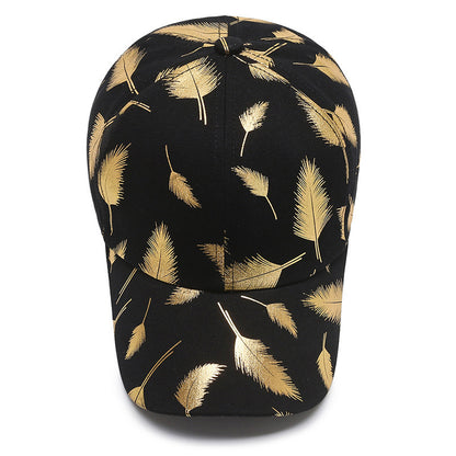 Black cap with gold leaf pattern on a white background