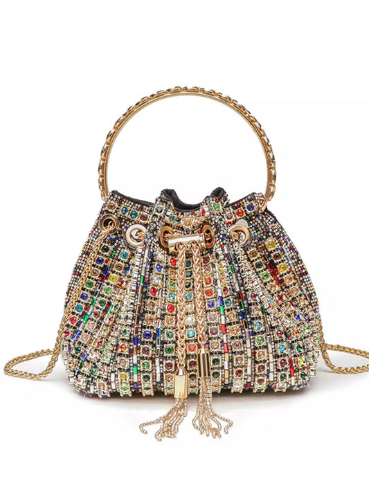 Multicolored beaded handbag with gold accents on a white background