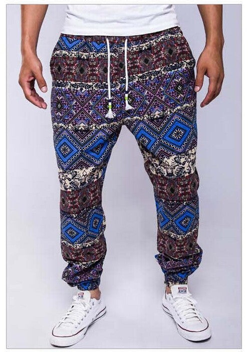 Patterned pants worn by a person on a white background