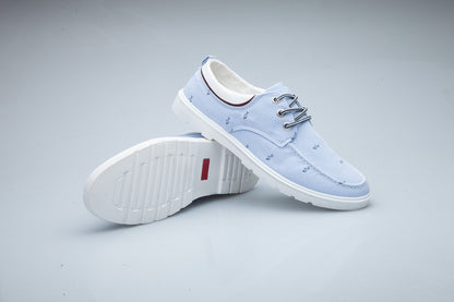 Light blue casual shoes on a gray background