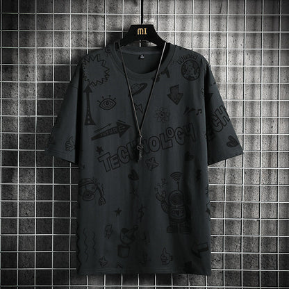 Black t-shirt with text and symbols on a hanger against a tiled wall.