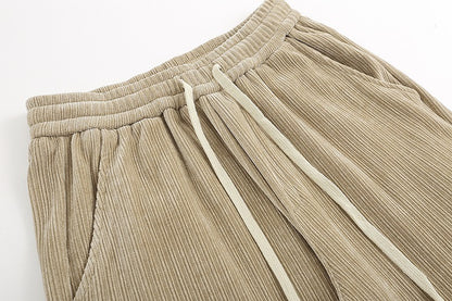 Beige pants with drawstring on a white background