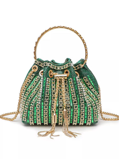 Green beaded handbag with gold accents on a white background