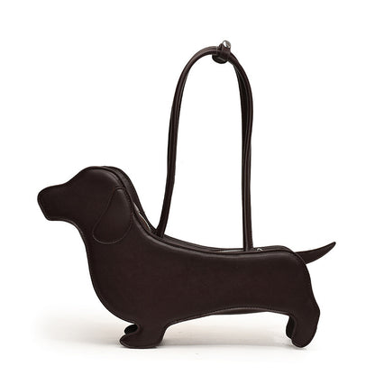 Black dachshund-shaped handbag on a white background