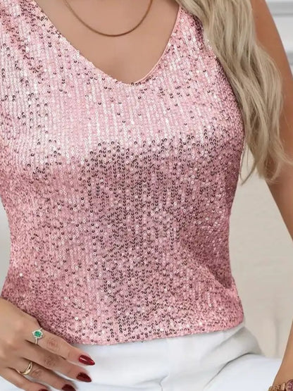 Pink sequin top worn by a person with a neutral background