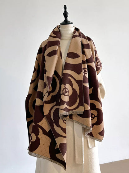 Mannequin wearing a brown and beige patterned scarf on a white background