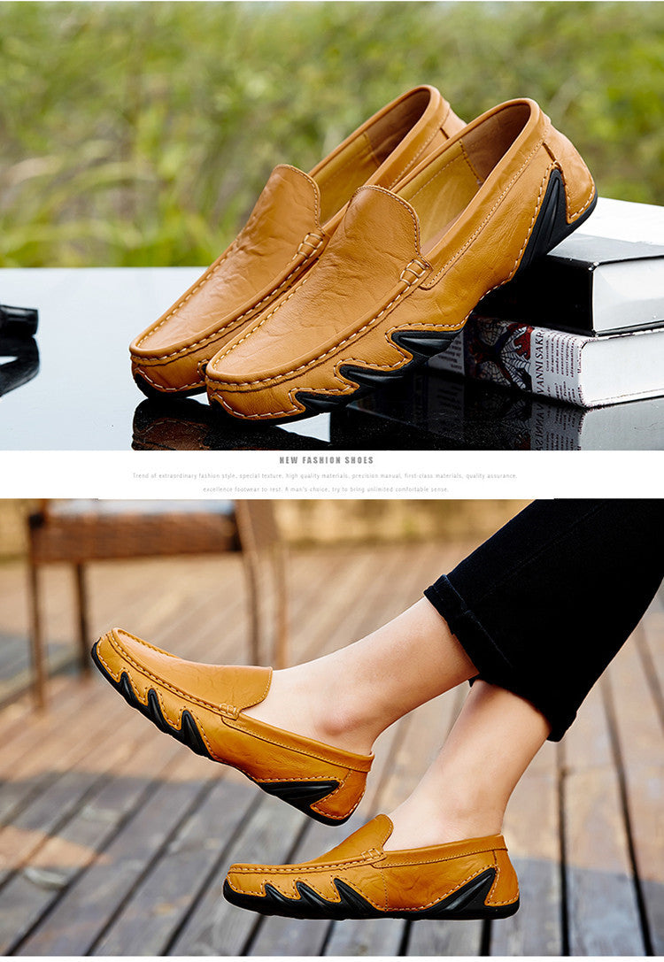 Yellow loafers with black accents on a reflective surface and being worn outdoors.