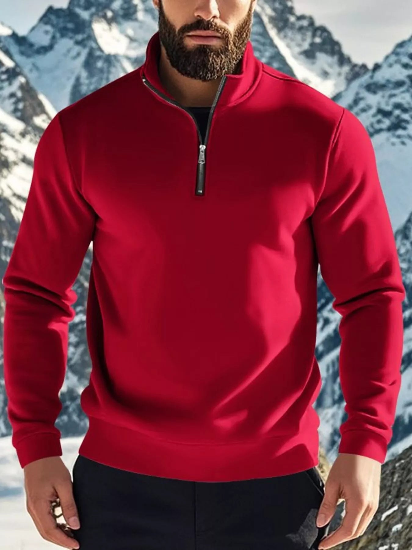 Person wearing a red pullover with a mountainous background