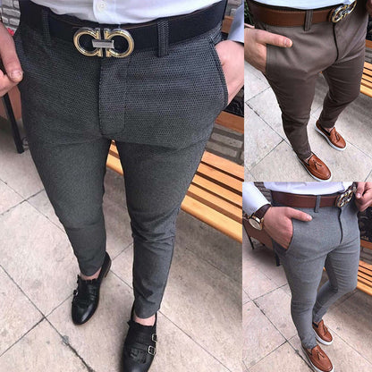 Two views of a person wearing gray patterned pants with a belt and shoes on a tiled floor.