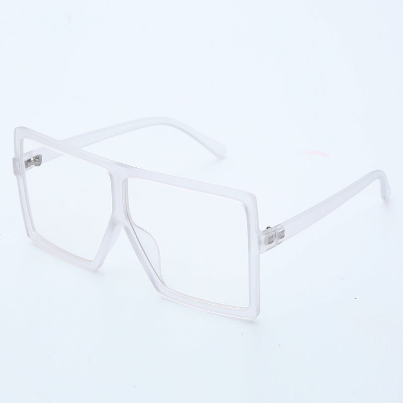 Clear eyeglasses on a light gray background
