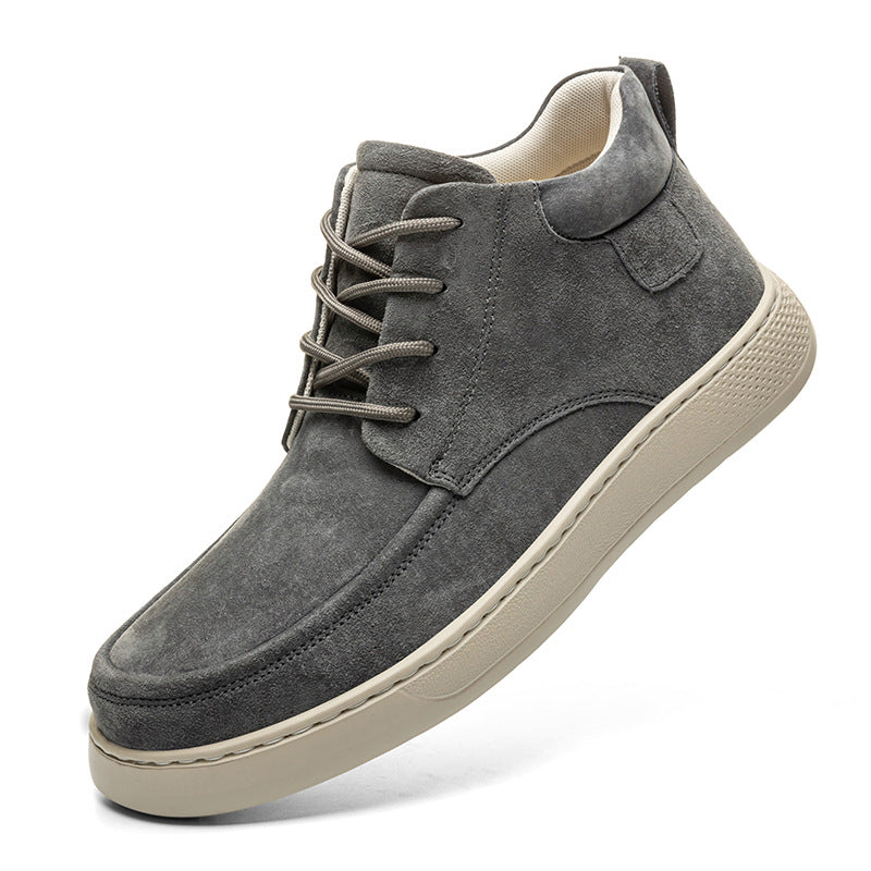 Gray suede sneaker with a white sole on a white background