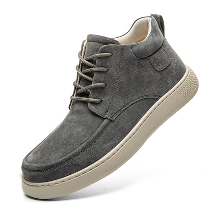 Gray suede sneaker with a white sole on a white background