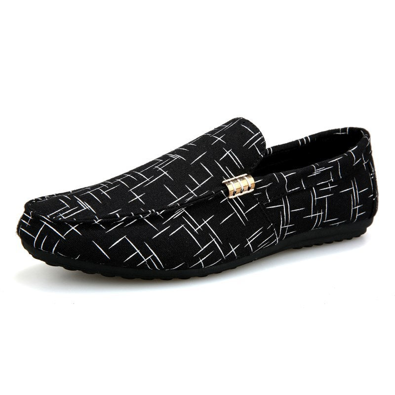 Black loafers with white geometric pattern on a white background