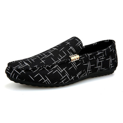 Black loafers with white geometric pattern on a white background