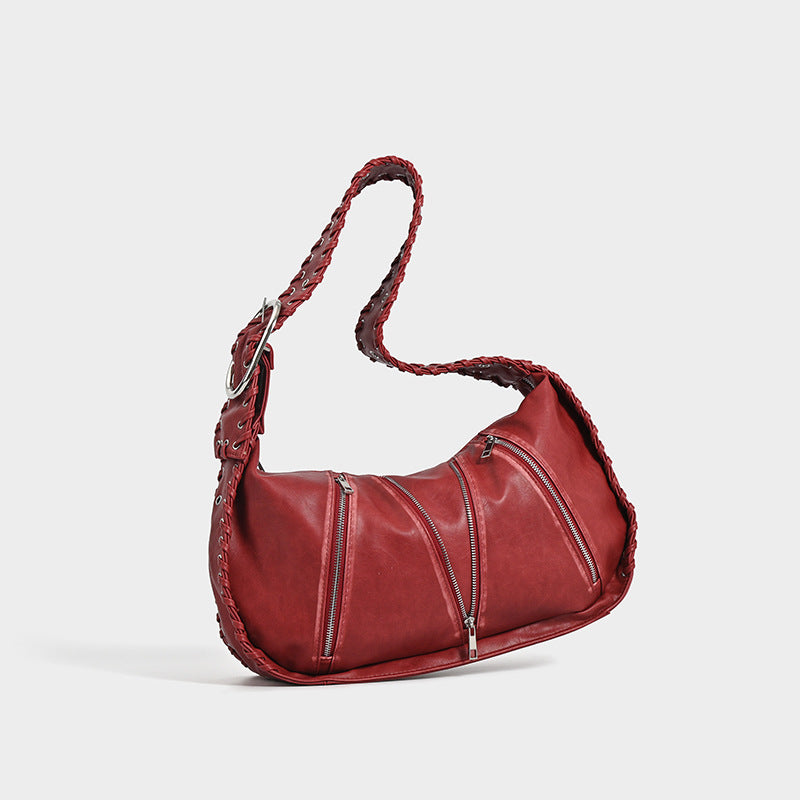 Shoulder bag with zipper details on a white background.