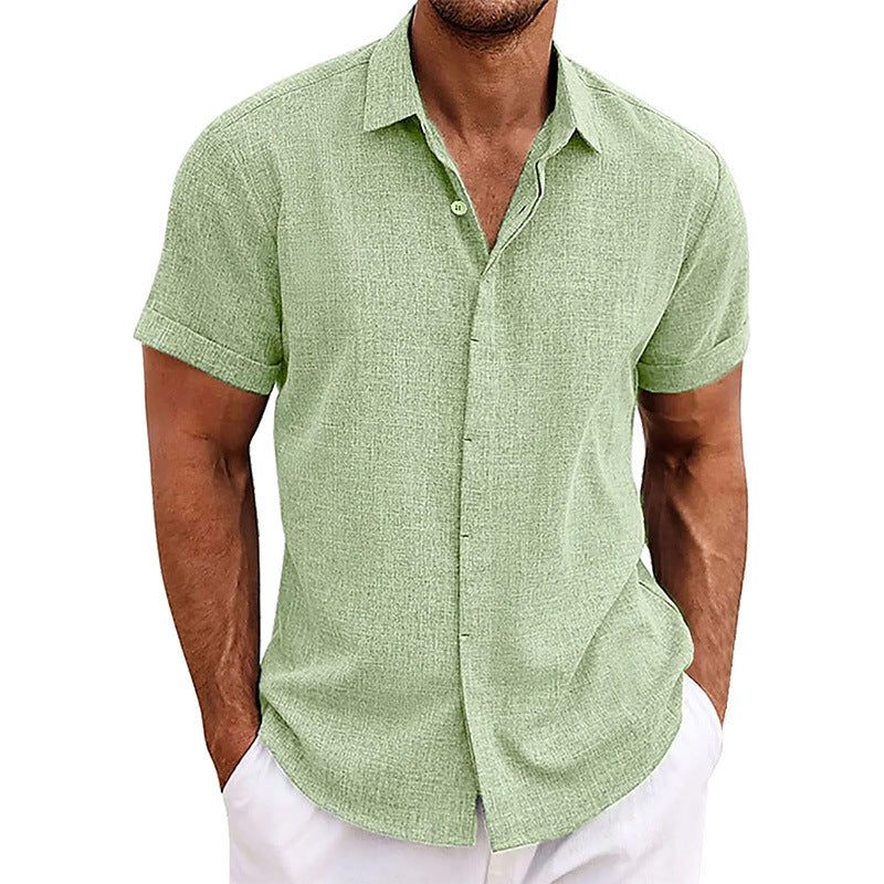 Man wearing a green short-sleeve shirt against a white background