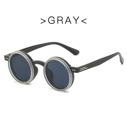 Round sunglasses with black frames and gray lenses on a white background