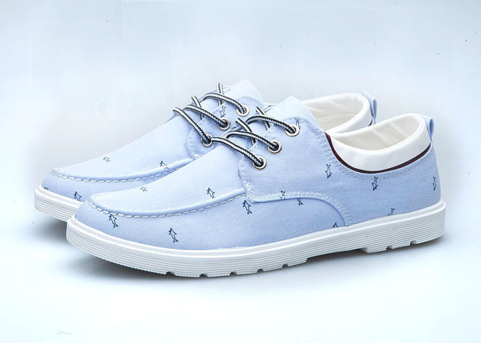 Light blue casual shoes with white soles on a light gray background