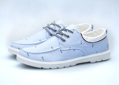 Light blue casual shoes with white soles on a light gray background