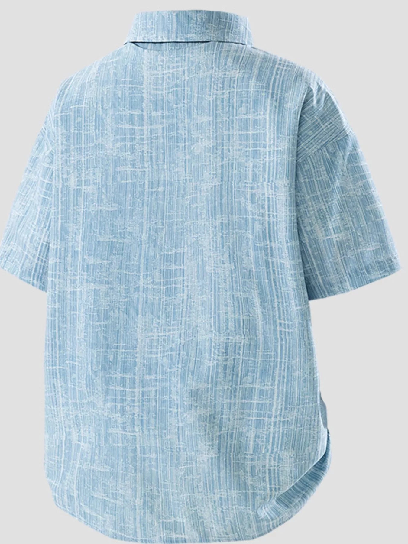 Blue textured shirt on a light gray background