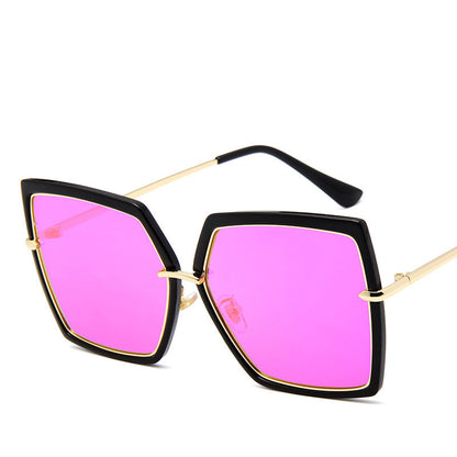 Sunglasses with pink lenses and black and gold frames on a white background
