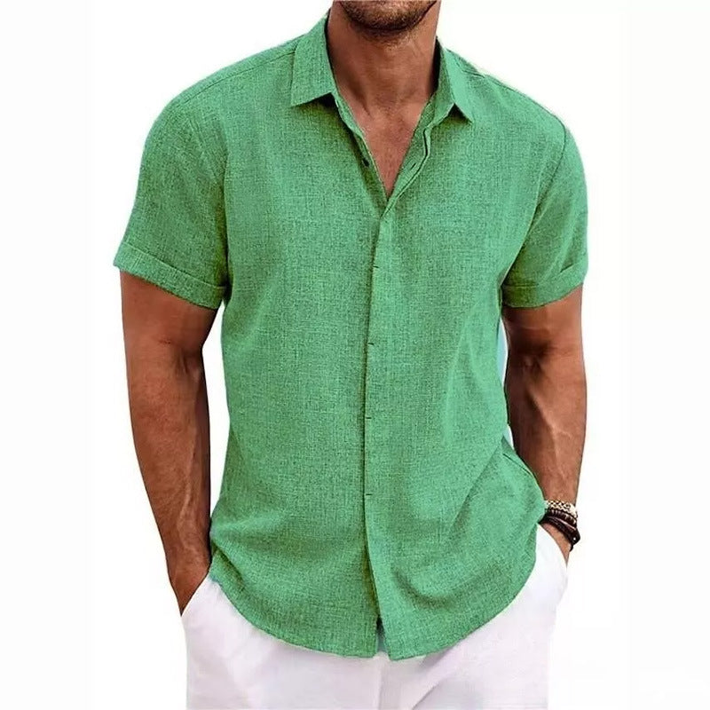 Man wearing a green short-sleeve shirt on a white background