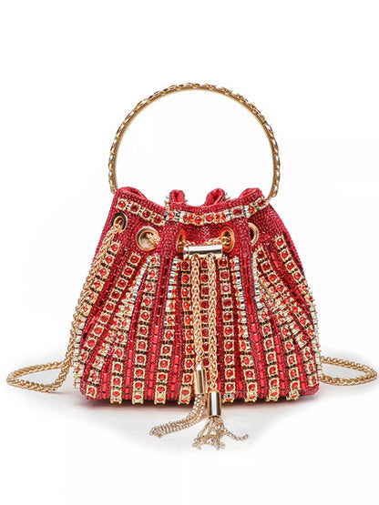 Red handbag with gold embellishments on a white background