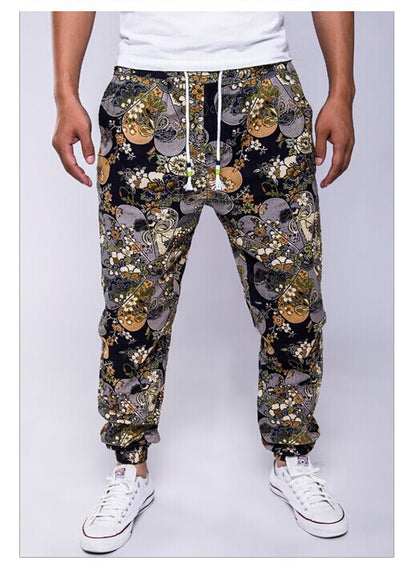 Person wearing a patterned jogger pants with a white background