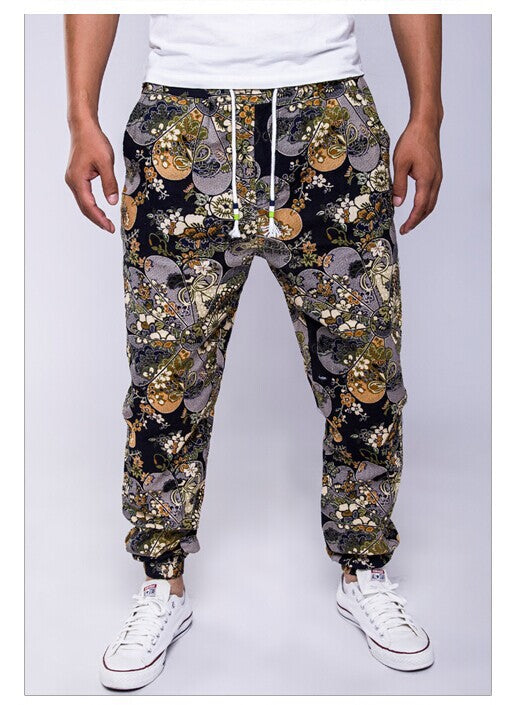 Person wearing a patterned jogger pants with a white background