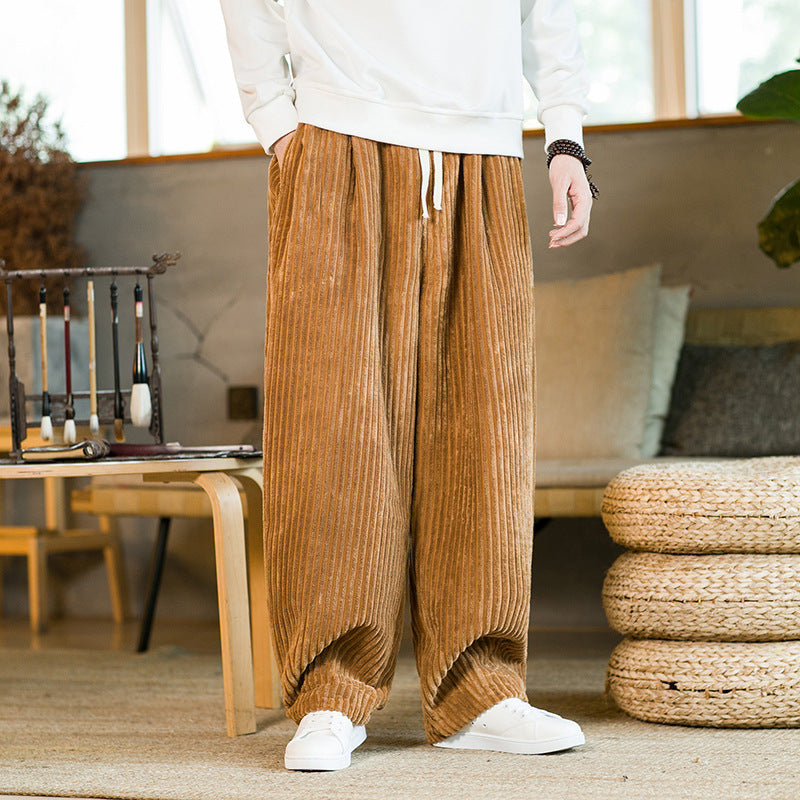 Person wearing brown corduroy pants in a home setting