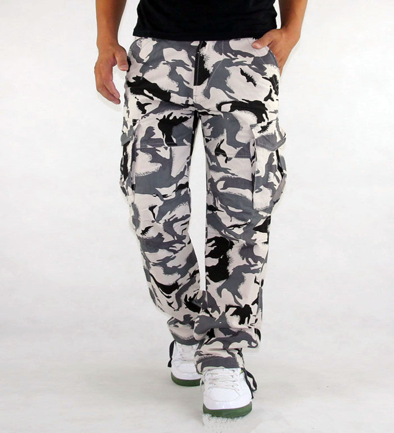 Camouflage pants worn by a person on a white background