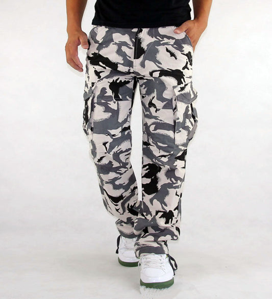 Camouflage pants worn by a person on a white background