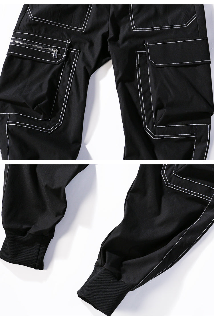 Black pants with white stitching on a white background