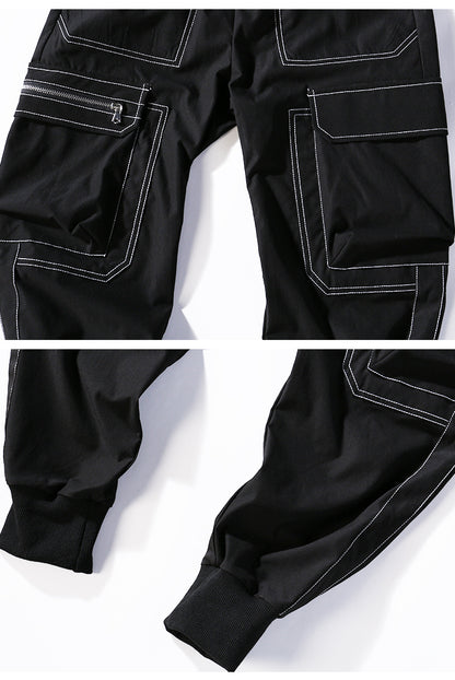 Black pants with white stitching on a white background