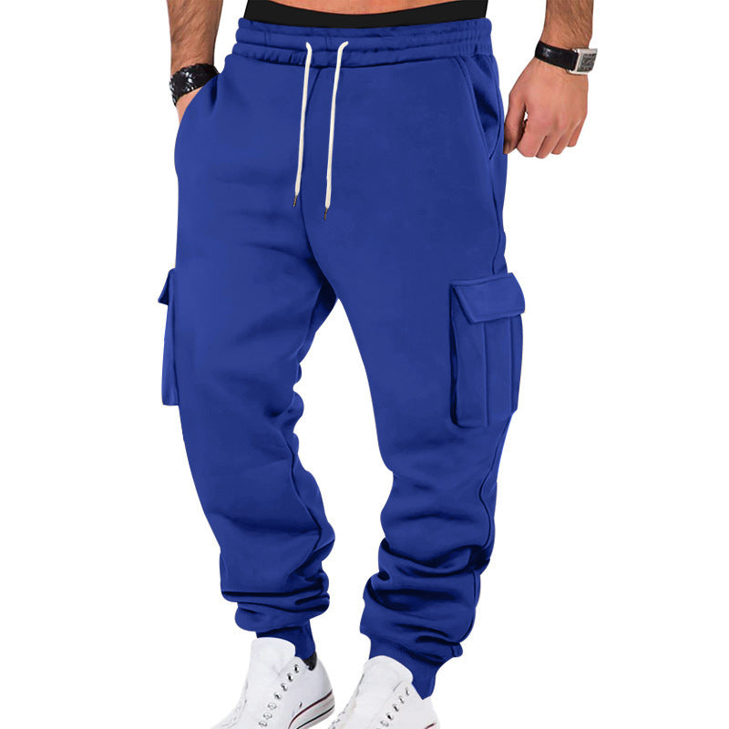 Blue cargo jogger pants worn by a person on a white background