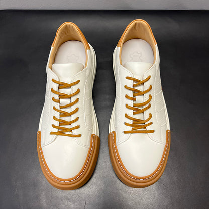 White sneakers with brown accents on a dark background