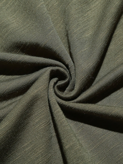 Close-up of olive green fabric with a subtle texture