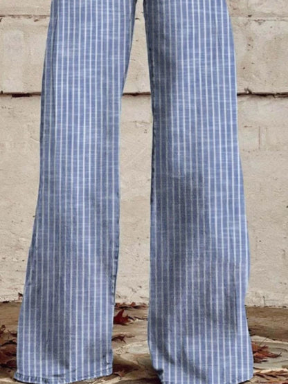 Blue and white checkered pants against a concrete wall.