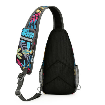 Black sling bag with colorful floral pattern on strap against a white background