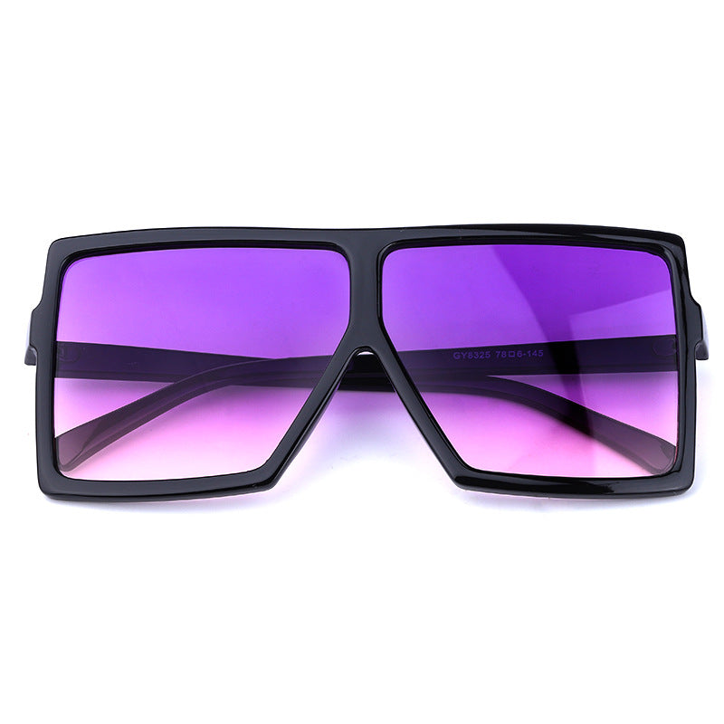 Sunglasses with black frame and purple lenses on a white background