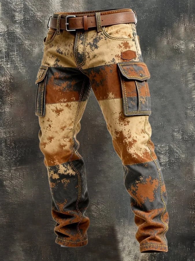 Rustic, patchwork-style pants with a brown belt on a textured gray background