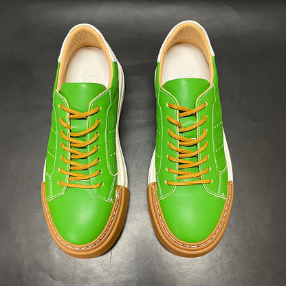 Green sneakers with brown accents on a dark gray background