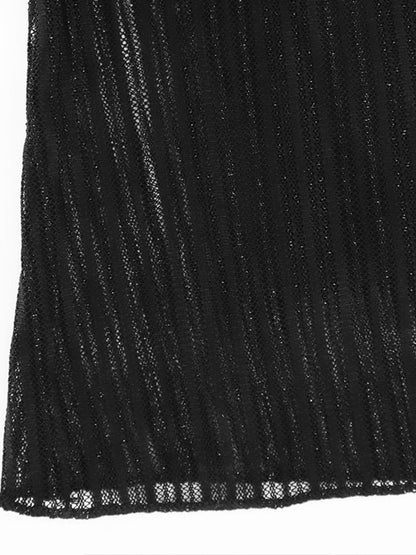 Close-up of a black ribbed knit fabric texture.