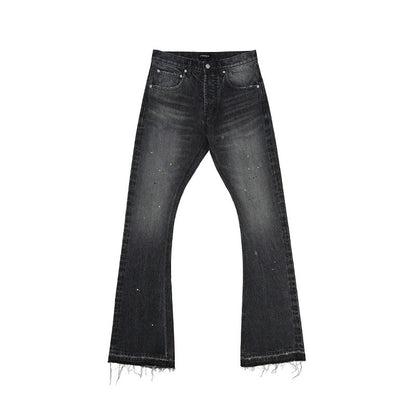 Black distressed jeans on a white background