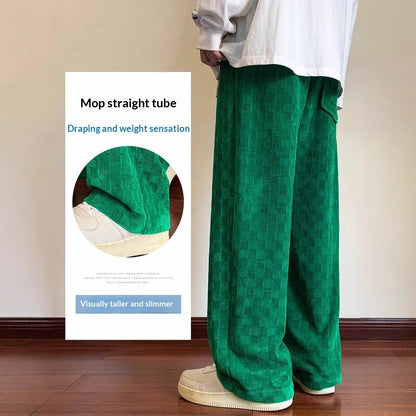 Person wearing green pants with a banner on the wall describing mop straight tube features.
