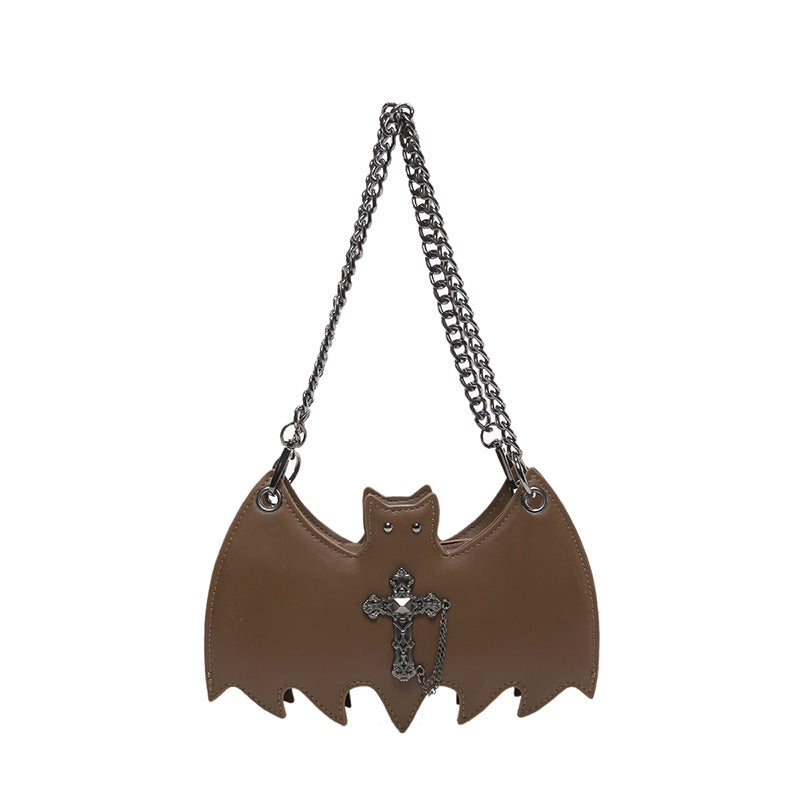 Handbag shaped as a bat on a white background.