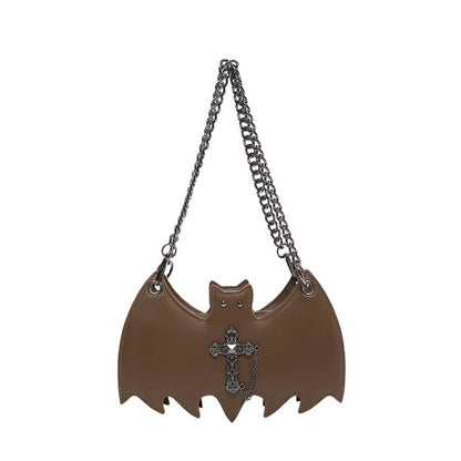 Handbag shaped as a bat on a white background.