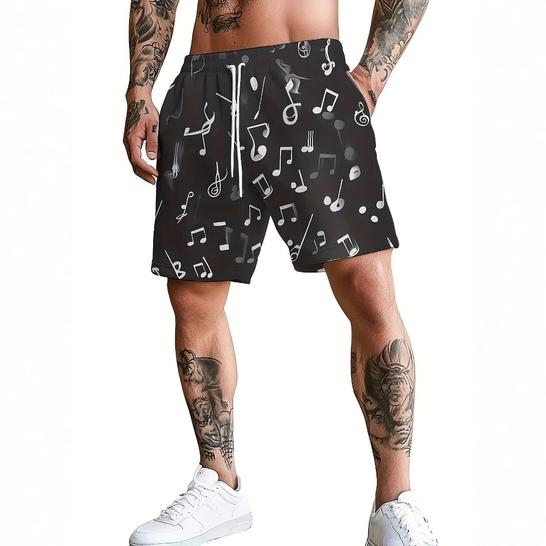 Person wearing black shorts with music note pattern on a white background