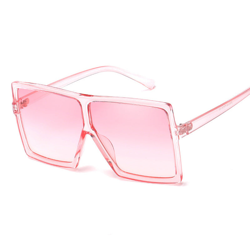 Pink sunglasses with a clear frame on a white background