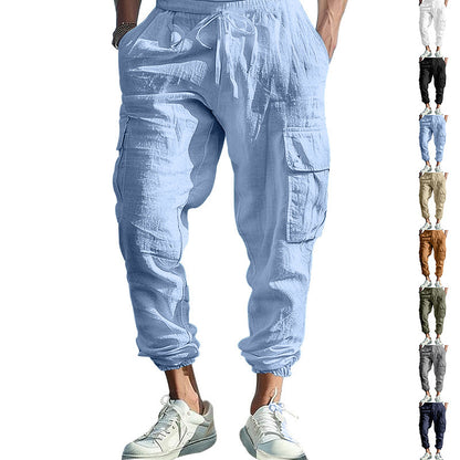 Light blue cargo jogger pants worn by a person on a white background with multiple color options displayed below.